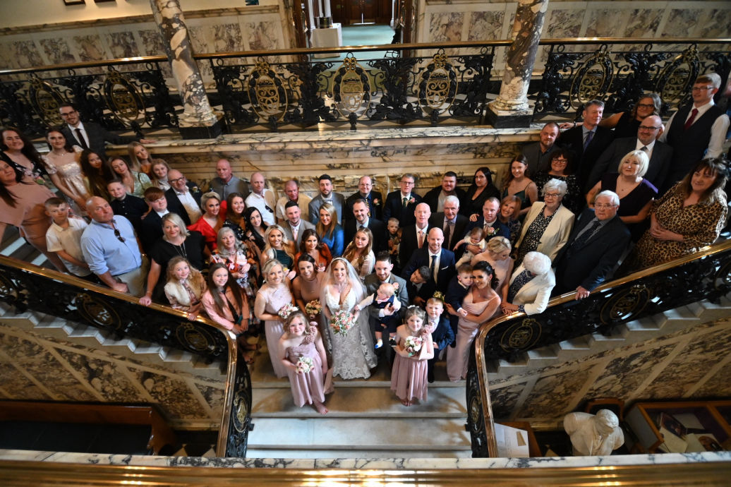 Registry office wedding guests celebrating after ceremony